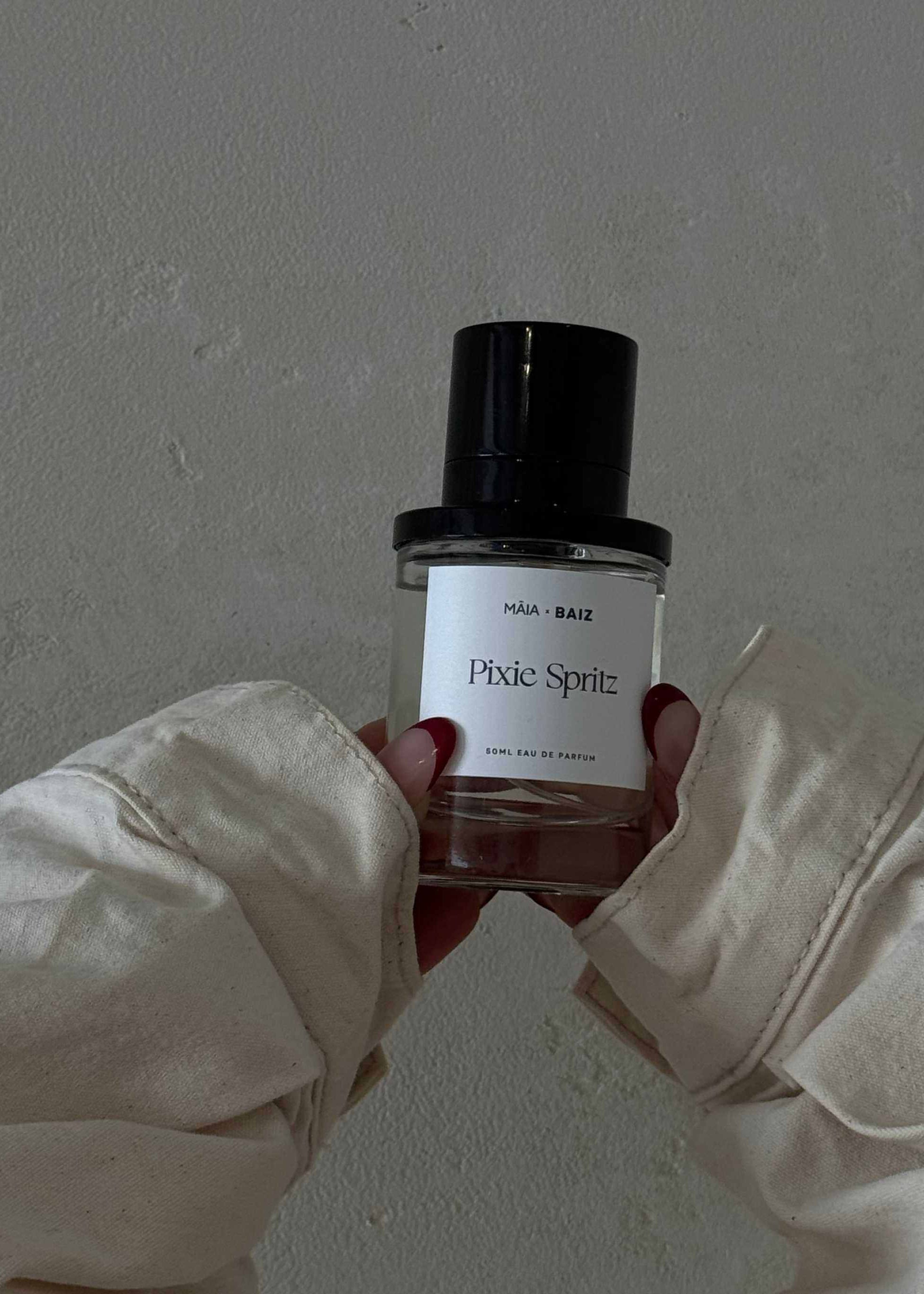 Māia Parfum Pixie Spritz 50ml bottle held in hands with neutral background